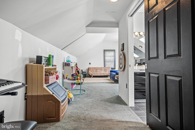 interior space with lofted ceiling and dark carpet