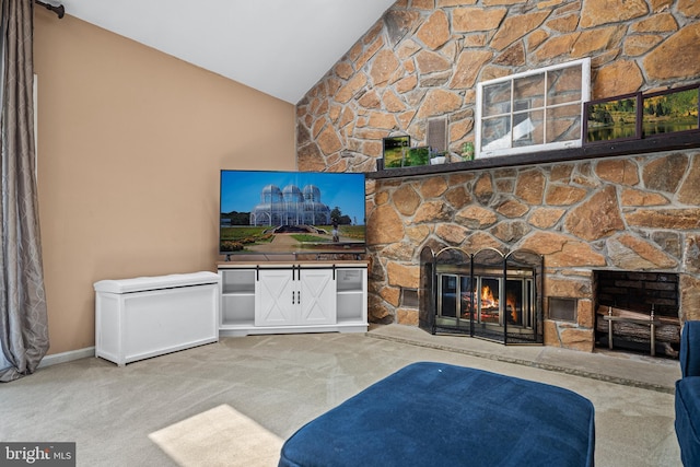 carpeted living room with lofted ceiling and a stone fireplace