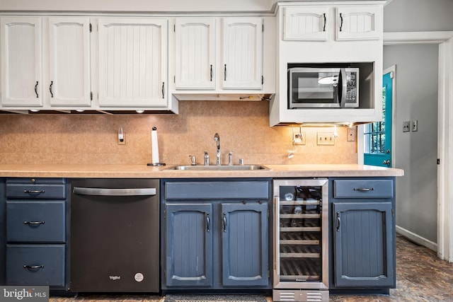 kitchen with white cabinetry, appliances with stainless steel finishes, beverage cooler, and sink