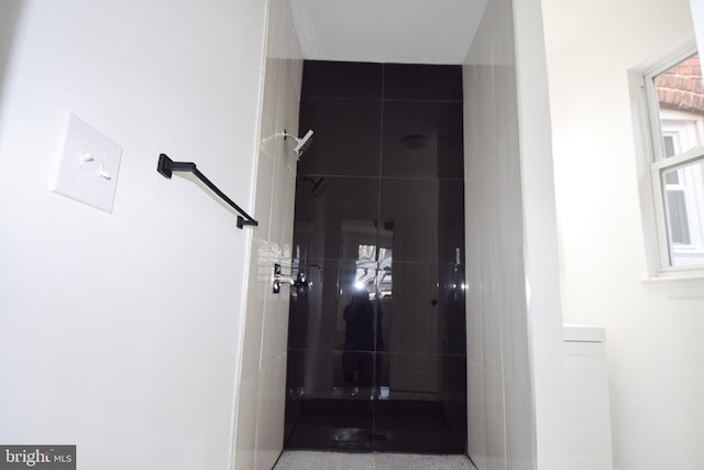 interior space featuring a tile shower