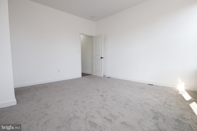 unfurnished room with carpet floors