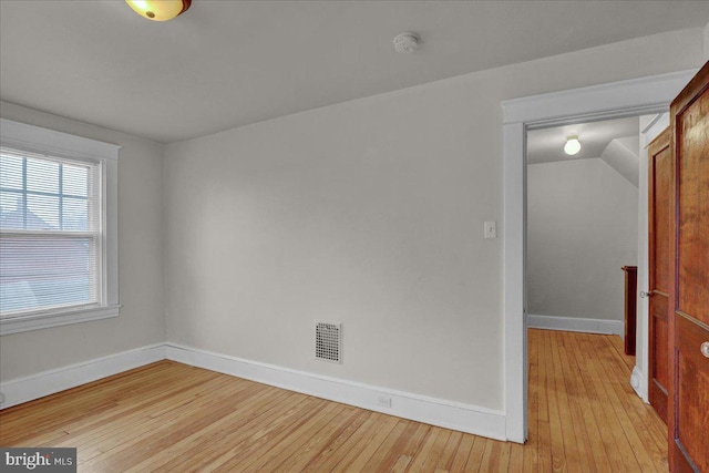 unfurnished room with light hardwood / wood-style floors