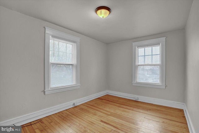 empty room with light wood-type flooring