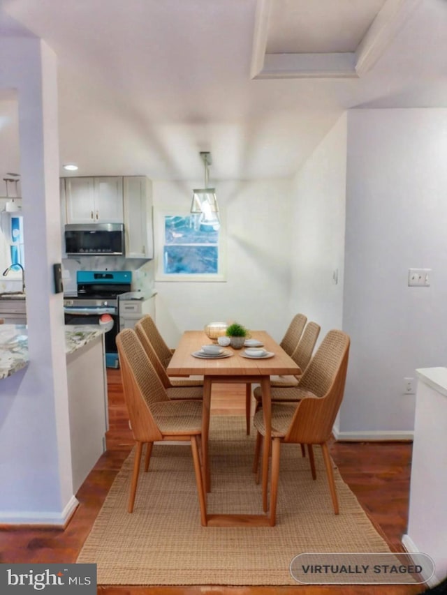 dining space featuring hardwood / wood-style flooring