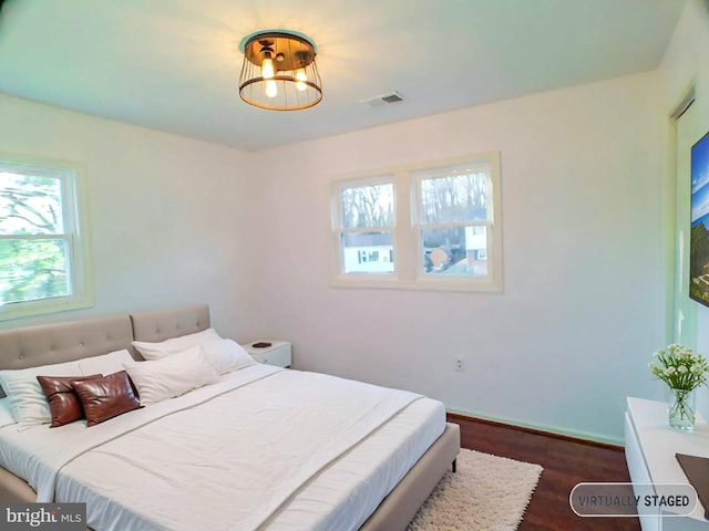 bedroom featuring dark hardwood / wood-style flooring