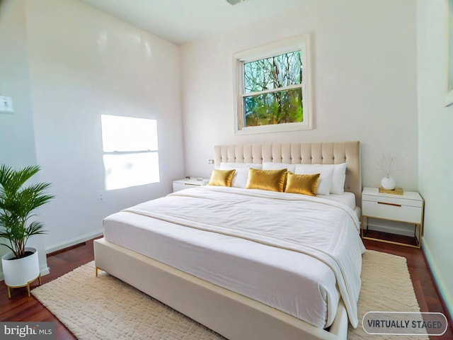 bedroom featuring dark hardwood / wood-style flooring