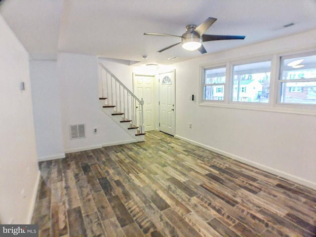 interior space with dark hardwood / wood-style floors and ceiling fan