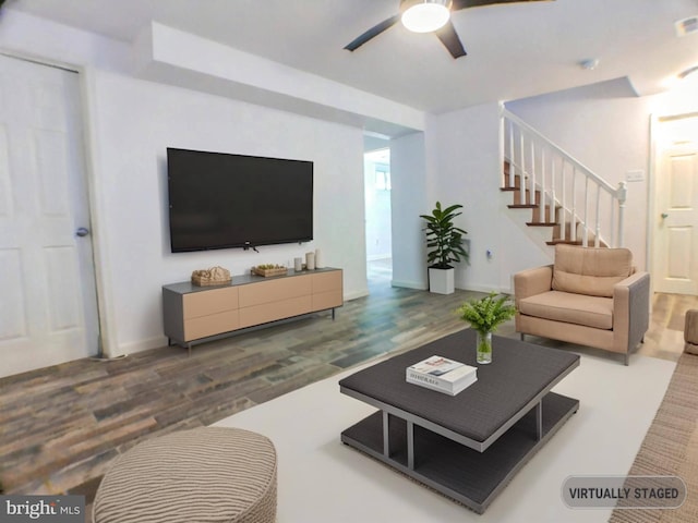 living room with hardwood / wood-style flooring and ceiling fan