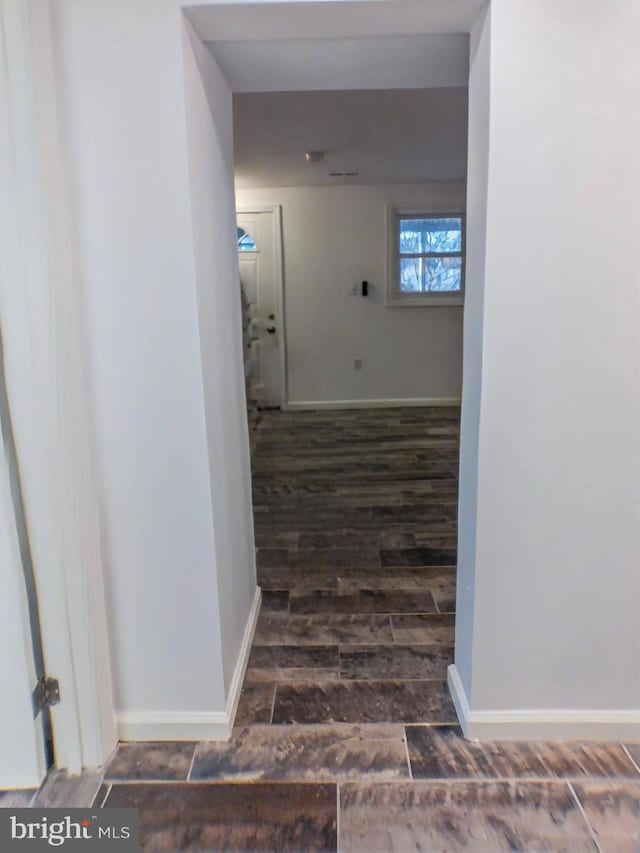 stairs featuring dark wood-type flooring