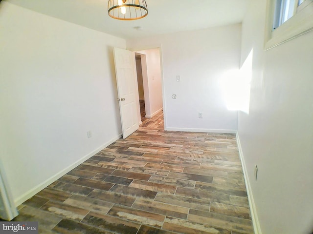 unfurnished room with dark hardwood / wood-style floors