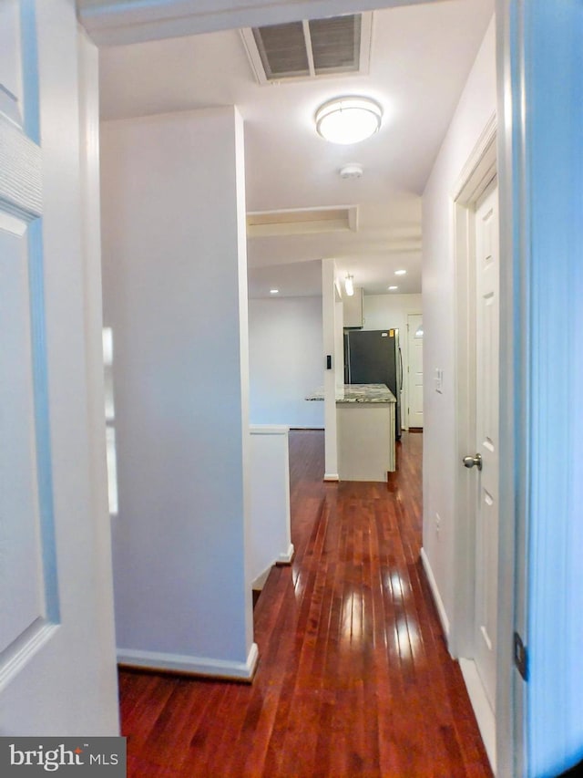 hall with dark wood-type flooring