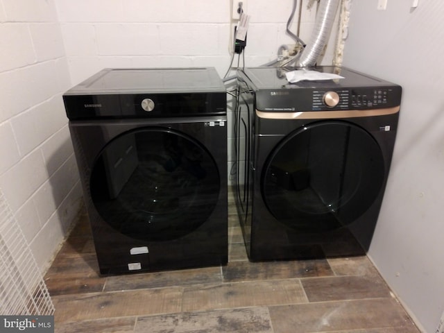 laundry area with separate washer and dryer