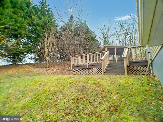 view of yard with a wooden deck and a sunroom