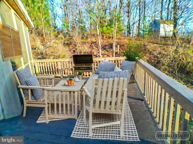 wooden terrace featuring grilling area