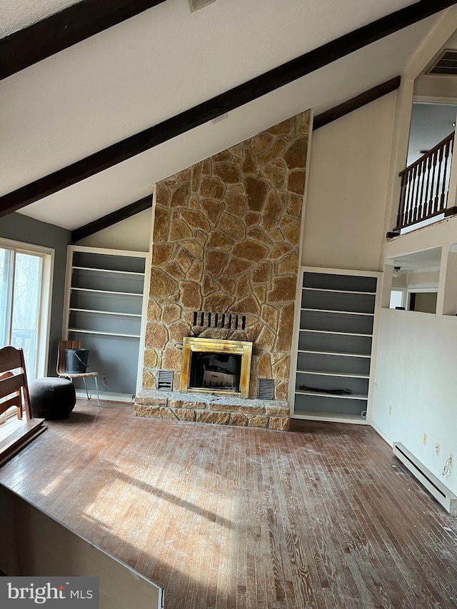 unfurnished living room featuring a stone fireplace, hardwood / wood-style floors, built in features, lofted ceiling with beams, and baseboard heating