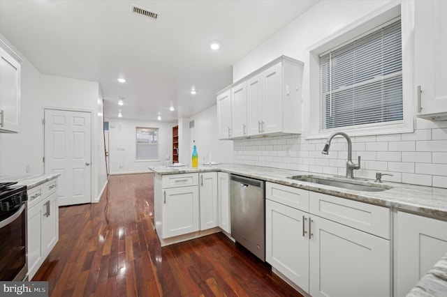 kitchen featuring appliances with stainless steel finishes, sink, and white cabinets