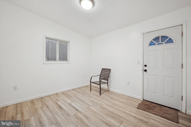 foyer entrance with light wood-type flooring