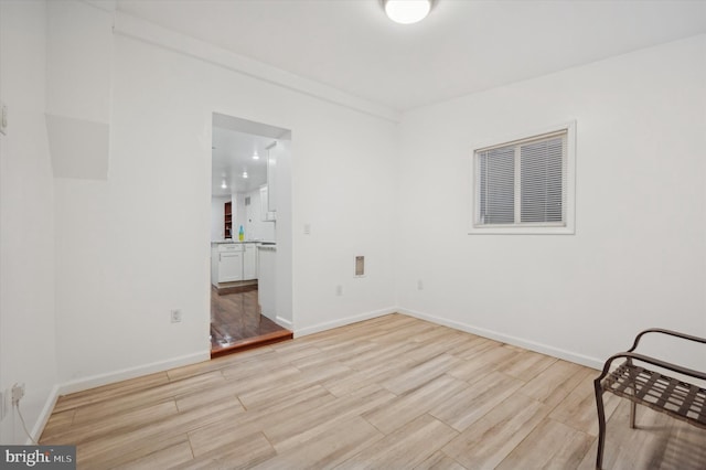 unfurnished room featuring light wood-type flooring