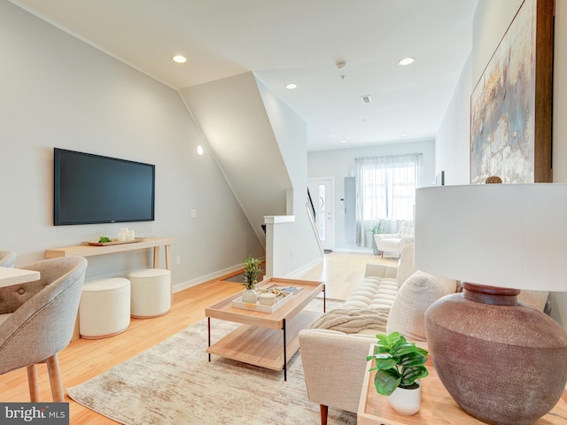 living room with light hardwood / wood-style flooring