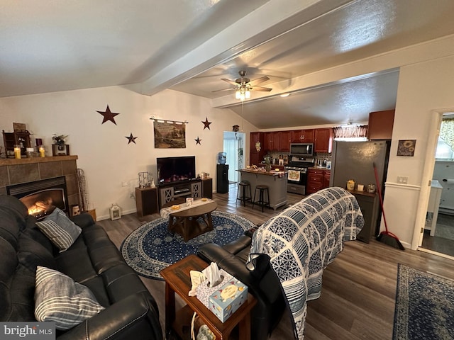 living room with a fireplace, lofted ceiling with beams, dark hardwood / wood-style floors, and ceiling fan