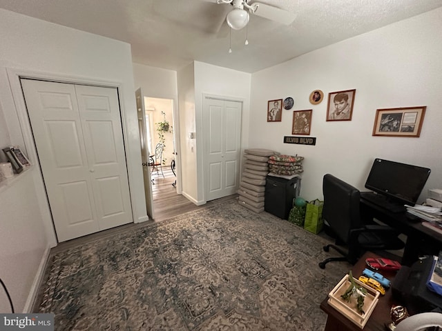 office featuring wood-type flooring and ceiling fan