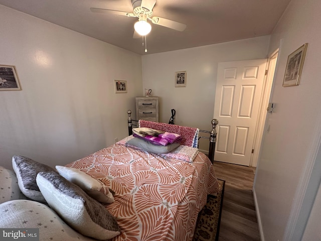 bedroom featuring dark wood-type flooring and ceiling fan