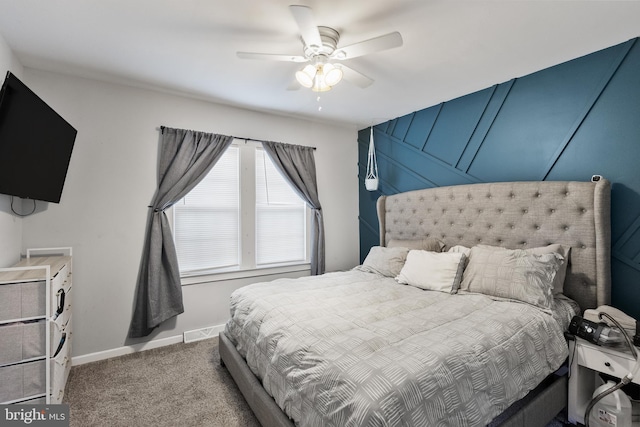 bedroom featuring ceiling fan and light carpet