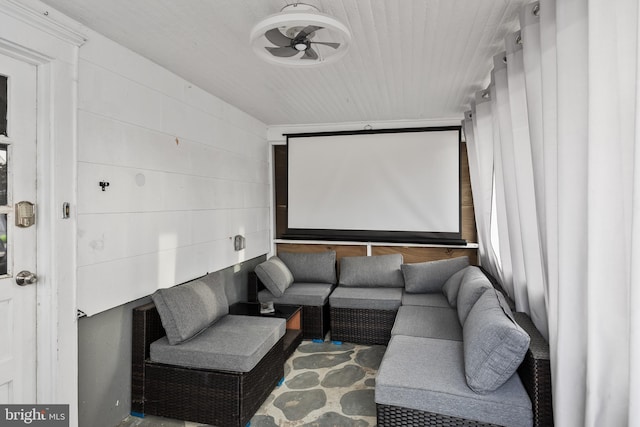 home theater room featuring ceiling fan