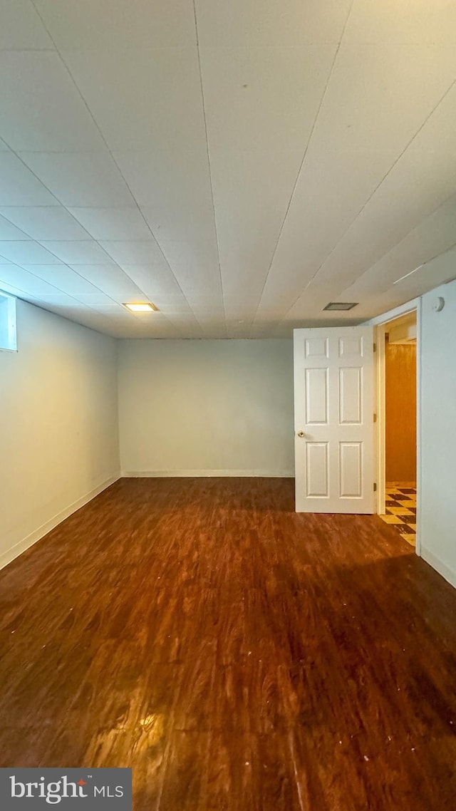 basement featuring hardwood / wood-style floors