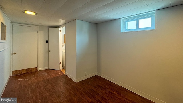 basement featuring dark wood-type flooring