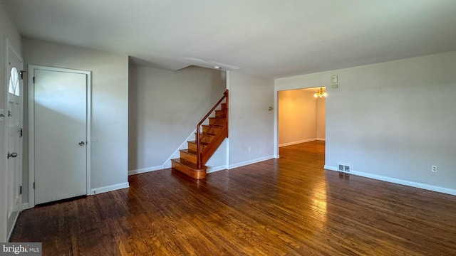 empty room featuring dark hardwood / wood-style flooring