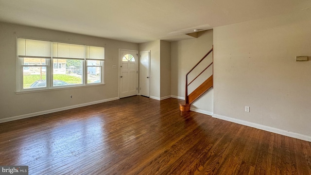 foyer entrance with dark hardwood / wood-style flooring