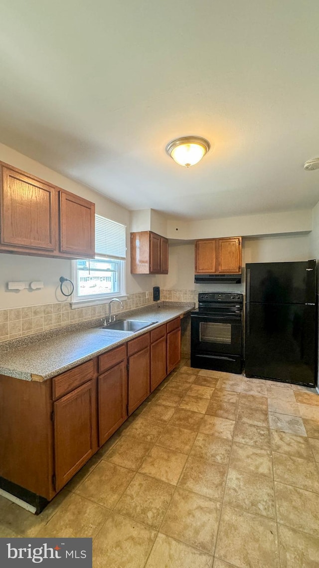 kitchen with sink and black appliances