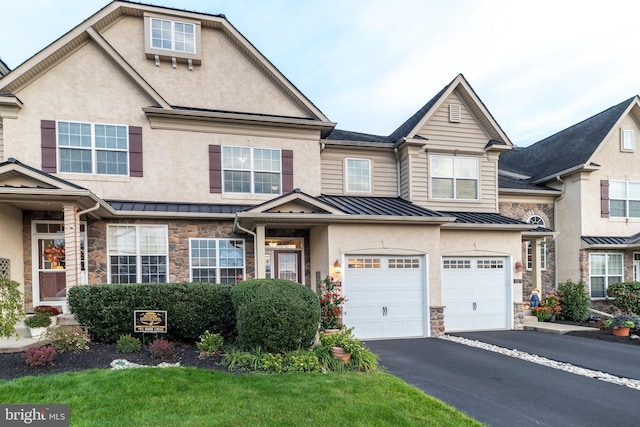 multi unit property featuring a garage