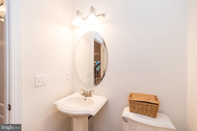 bathroom with toilet and sink