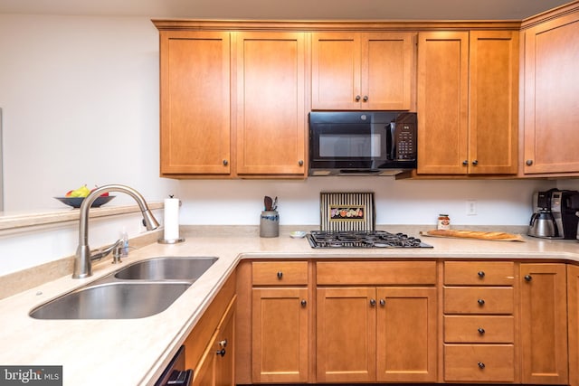 kitchen with stainless steel gas stovetop and sink