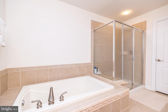 bathroom with separate shower and tub