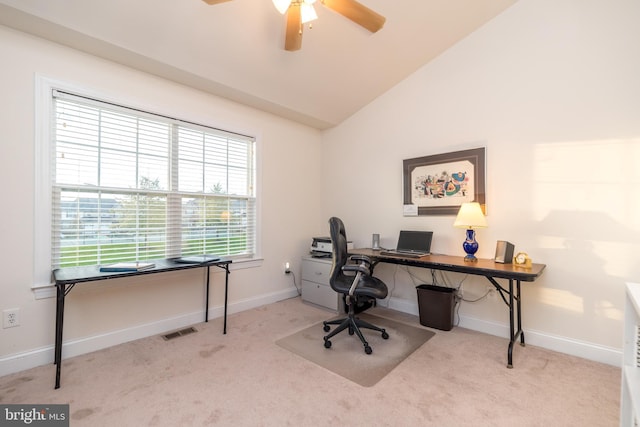 carpeted office featuring lofted ceiling and ceiling fan