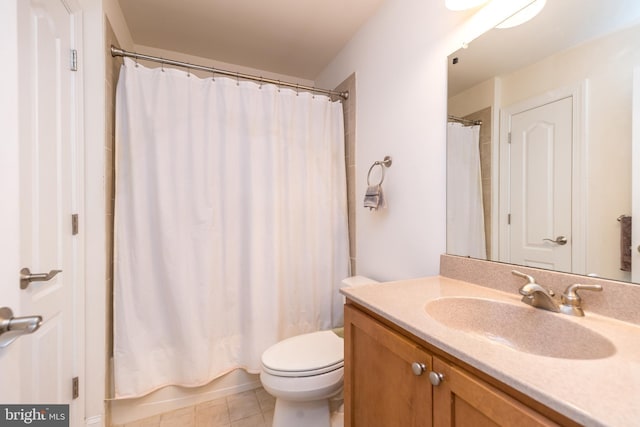 full bathroom with vanity, shower / tub combo, tile patterned floors, and toilet