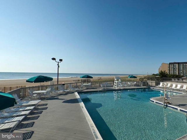 view of pool with a water view