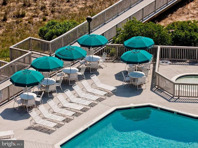 view of swimming pool featuring a wooden deck