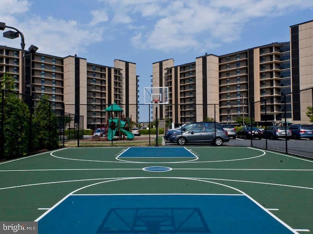 view of sport court with a playground