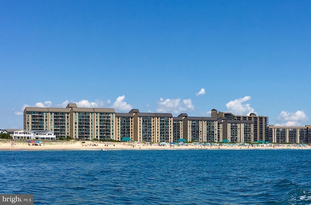 property view of water featuring a beach view