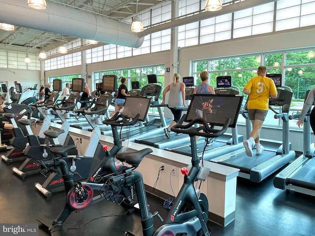 gym with a towering ceiling