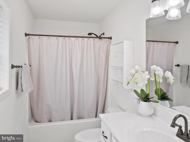 full bathroom with vanity, toilet, and shower / tub combo