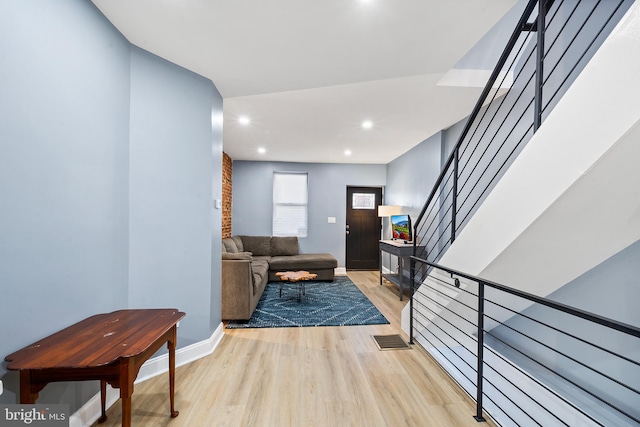 living room with light hardwood / wood-style flooring