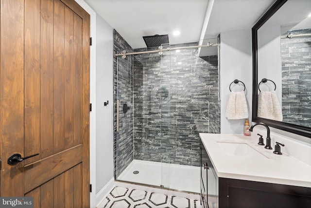 bathroom with vanity and a shower with shower door