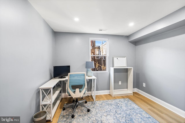 office space with hardwood / wood-style floors