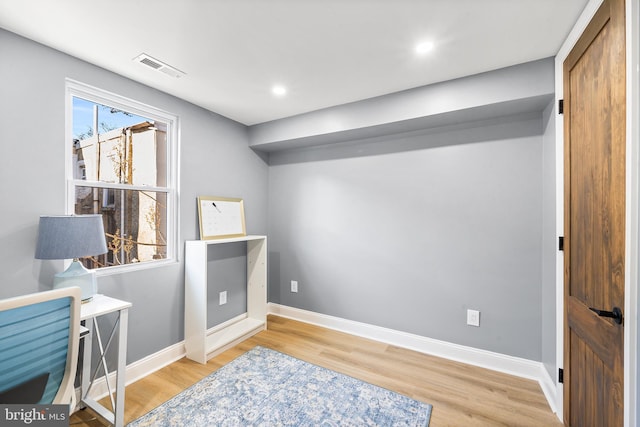 office area with hardwood / wood-style flooring