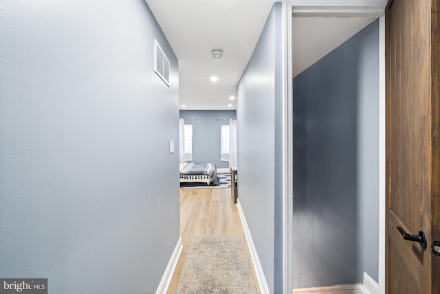 hallway featuring light wood-type flooring